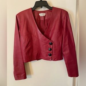Cute, short, red faux leather jacket.